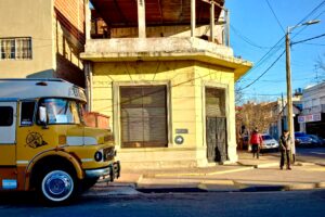 Quaint corner, yellow old house and yellow old bus in Dock Sud, hoem to the Cape Verdean diaspora in Buenos Aires, Argentina.